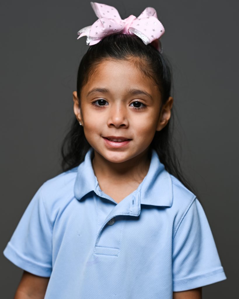 A girl in blue shirt