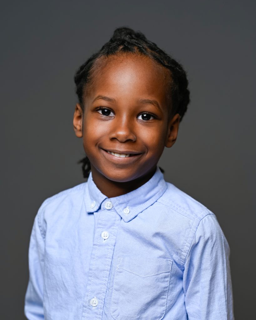 a kid in blue polo