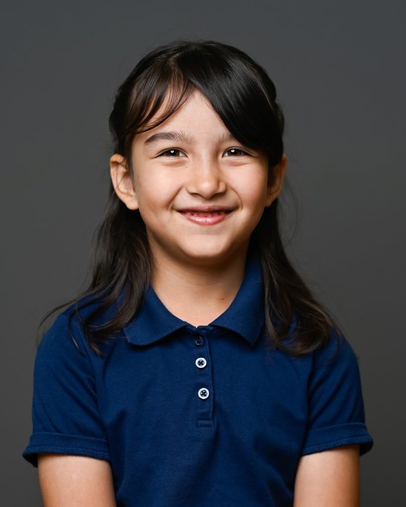 A girl in navy blue shirt