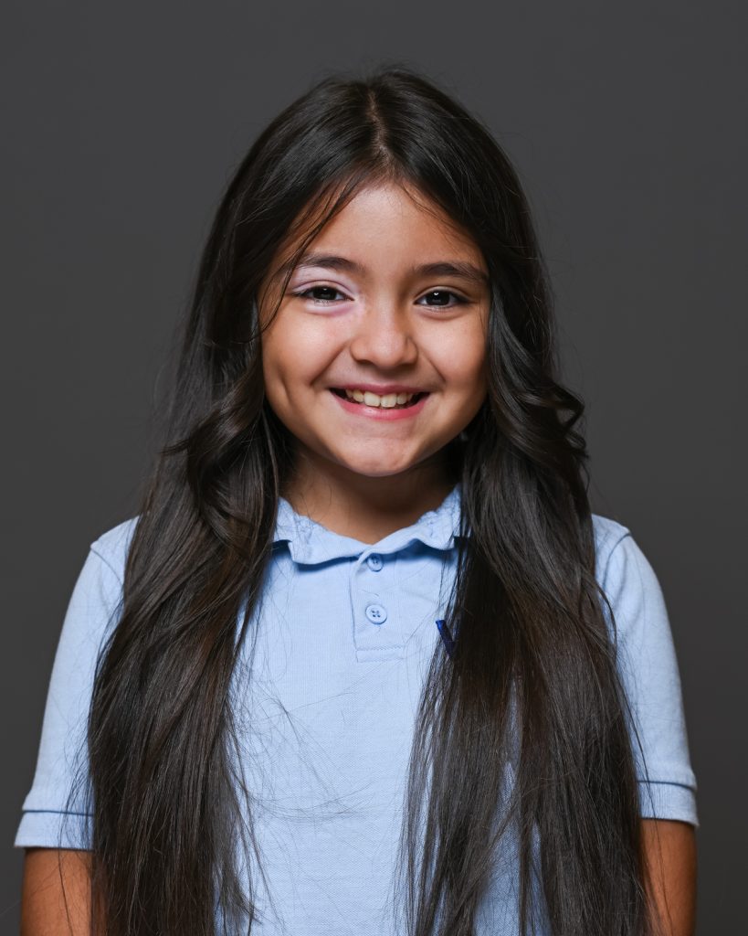 a girl in blue shirt