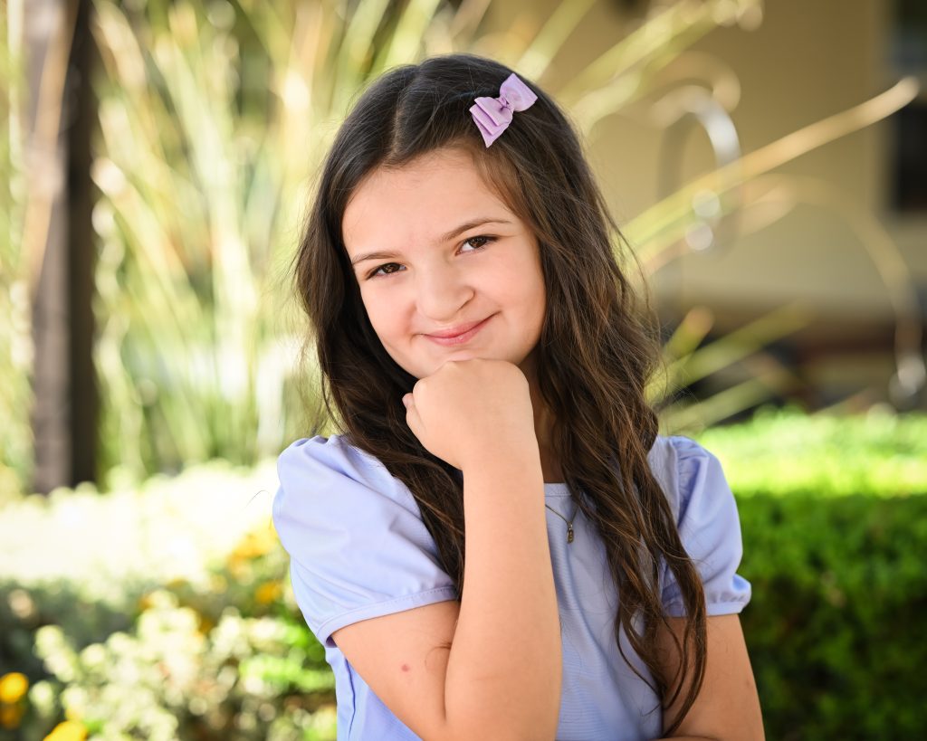 a girl with a ribbon on her hair