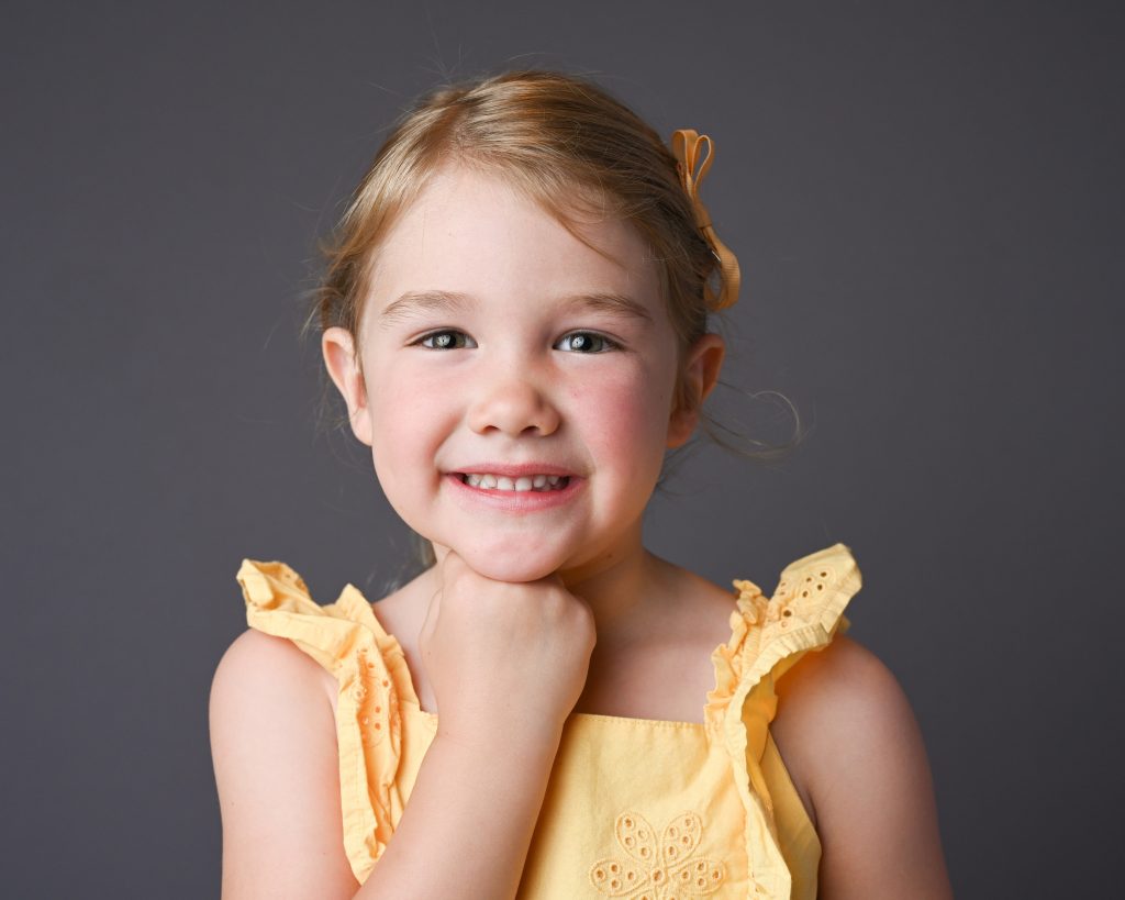 a girl in a yellow top
