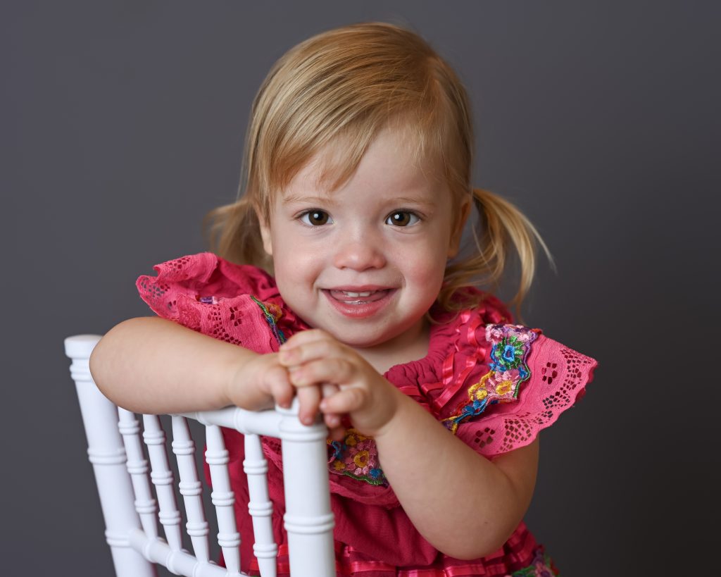 a kid in pink dress