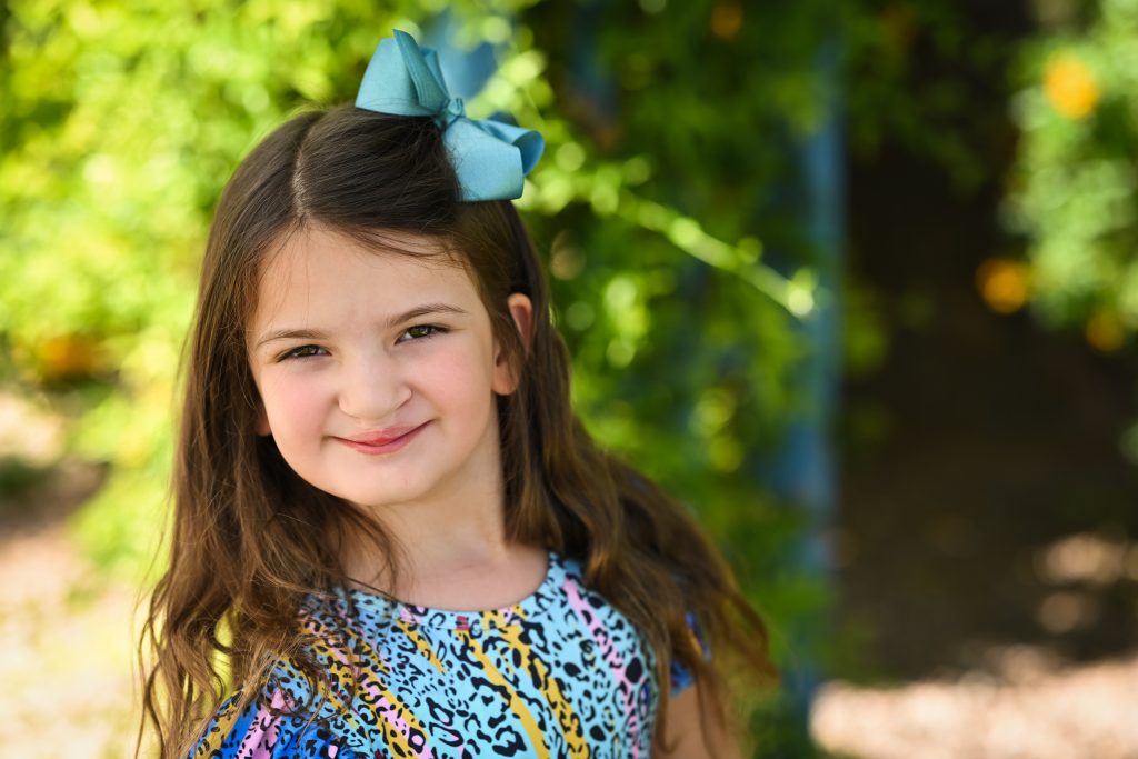 a girl with a bow on her hair